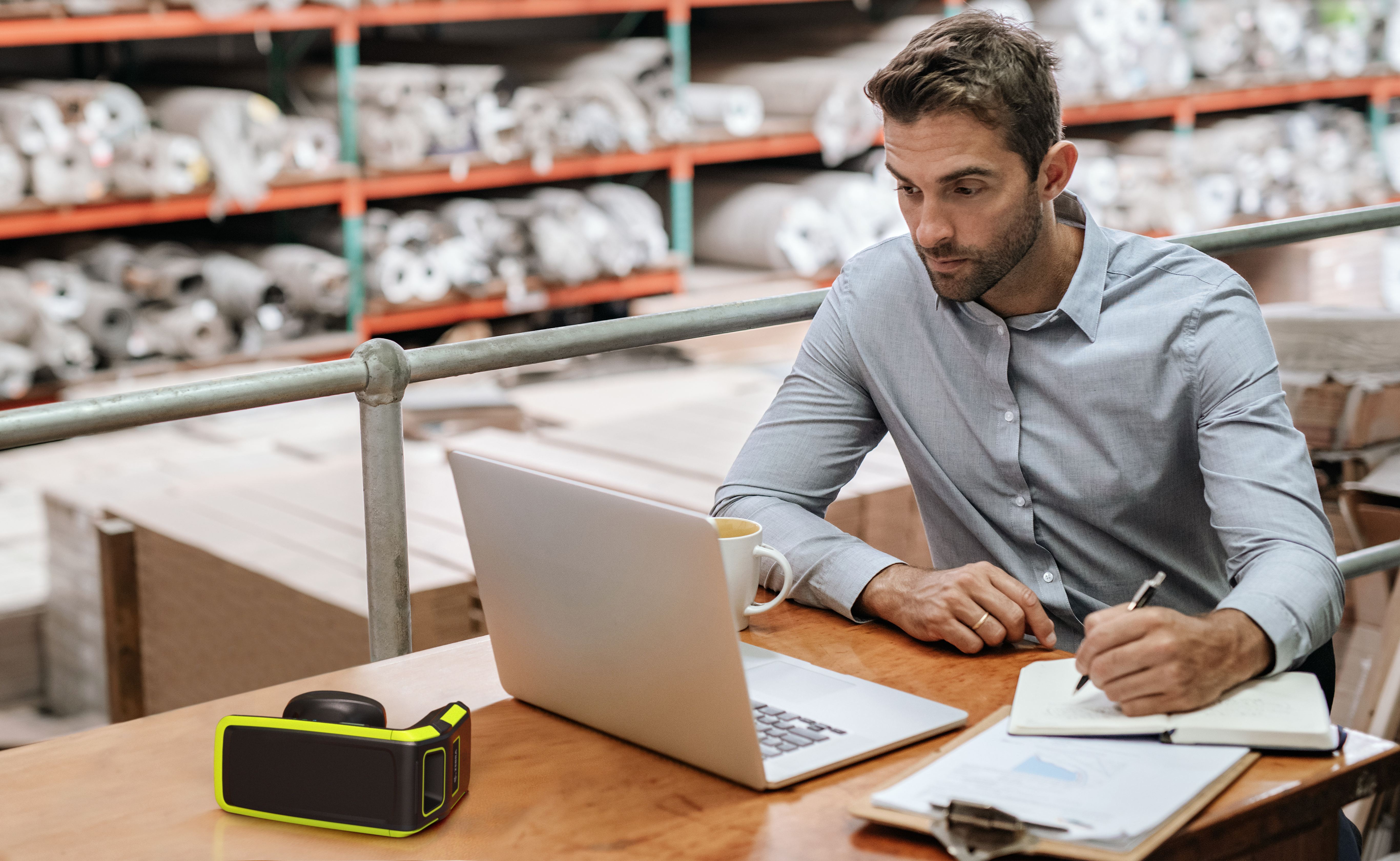 image of a guy using reporting in warehouse